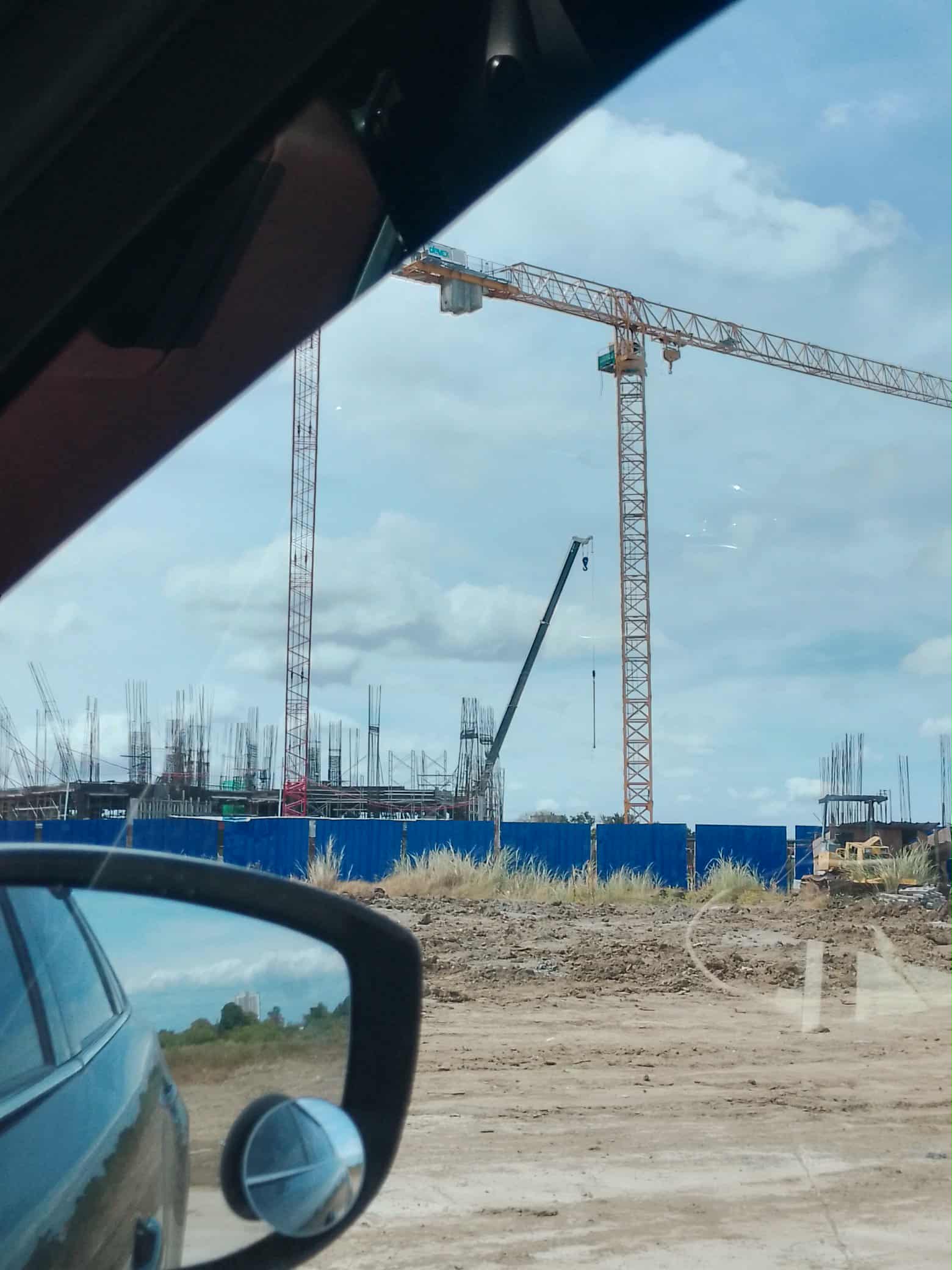 Villar City southern growth corridor — open land and active construction